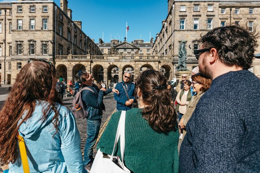 Edinburgh: Old Town History and Tales Walking Tour - Mercat Cross: the market and meeting place behind the views